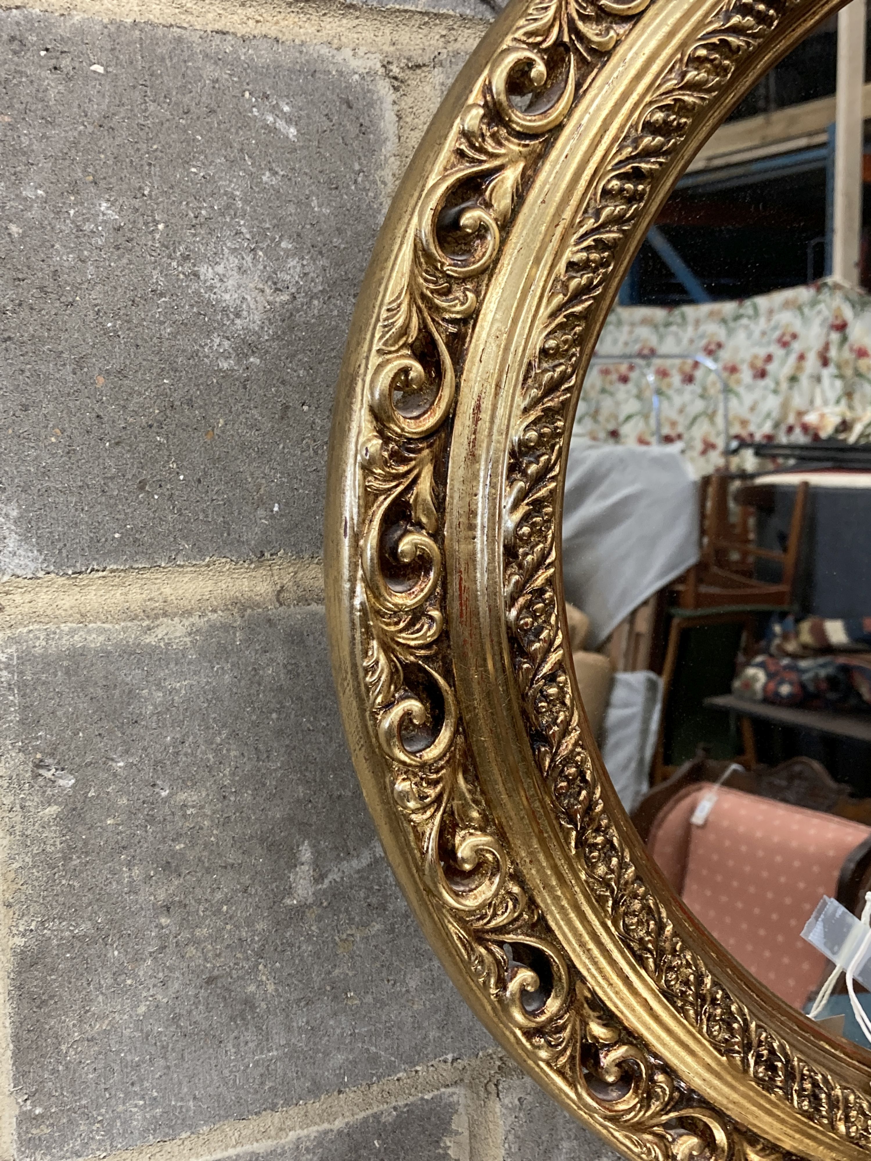 Two Victorian style oval gilt frame wall mirrors, larger 114cm, height 74cm